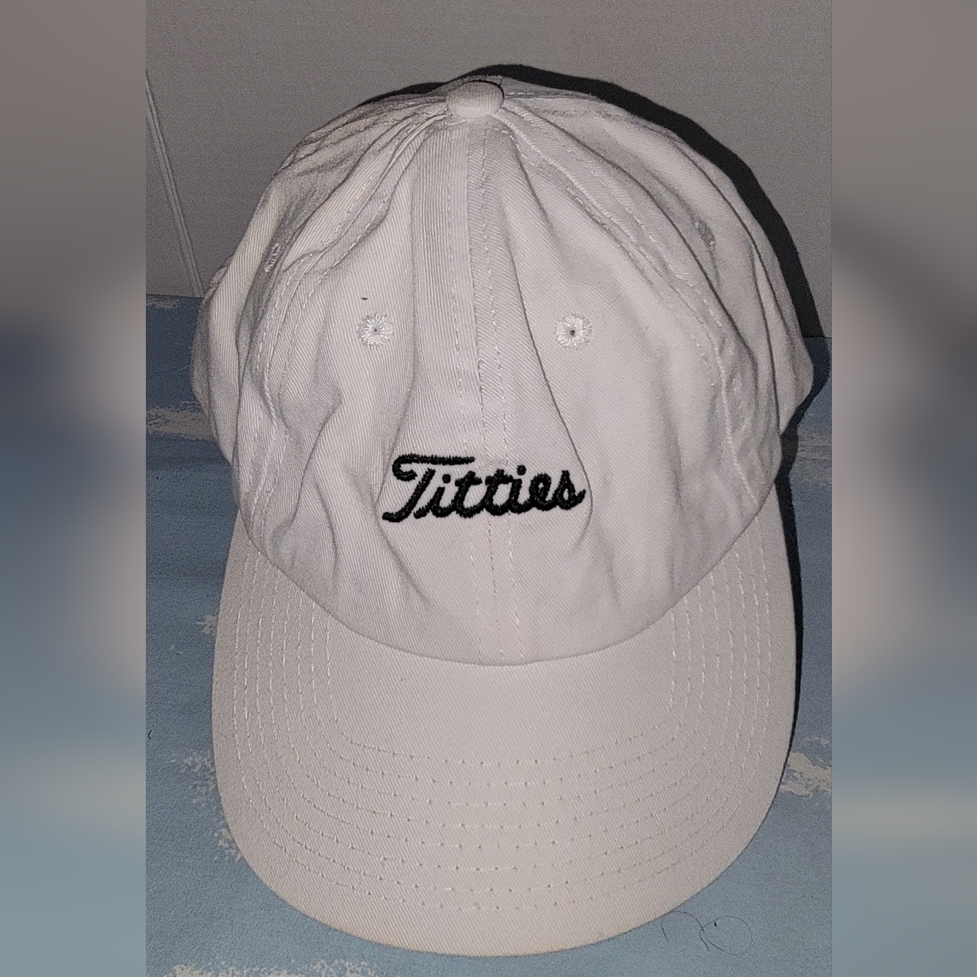 White Baseball Cap With Embroidered Logo